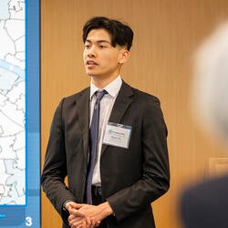 Alumni Bryan Ho giving a presentation.