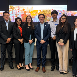 A group of students with Philip Falcone, Riverside Councilmember.